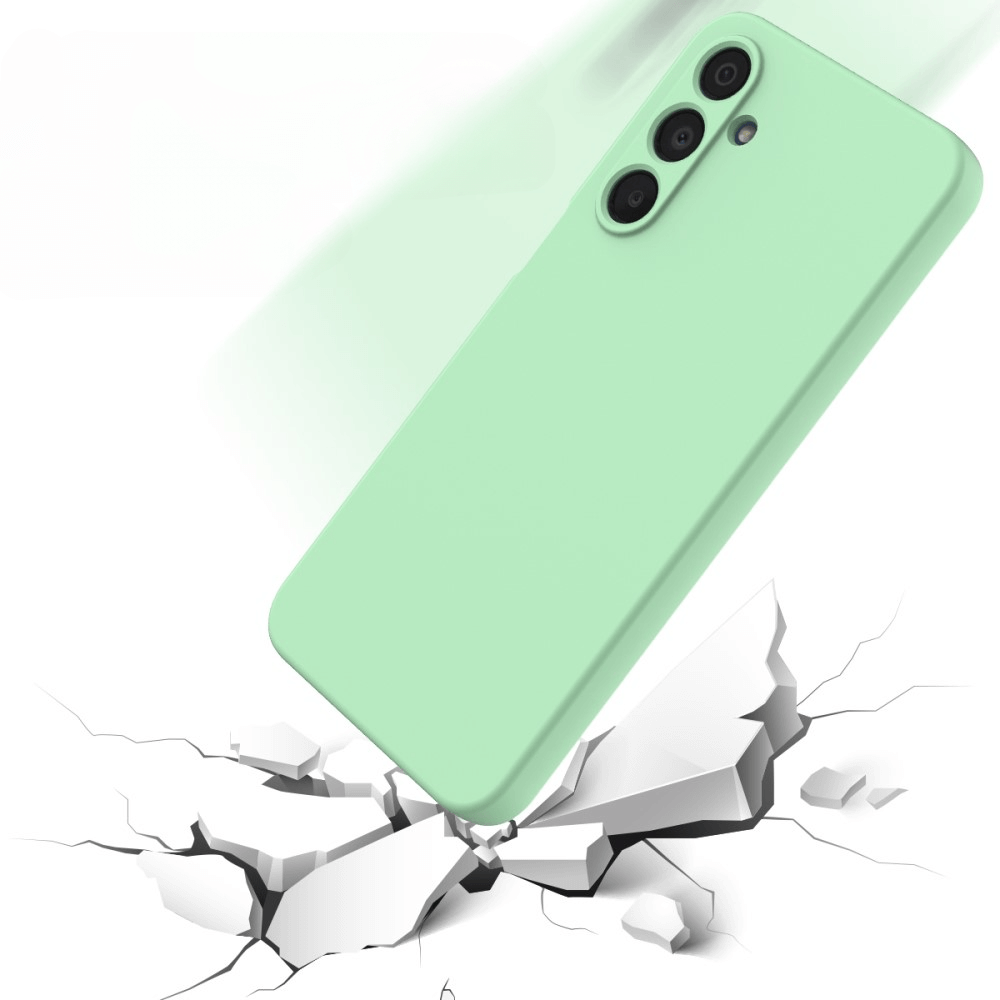 A Cover-Discount Galaxy A16 - Silikon Gummi Hülle mit Riemen in Grün fällt auf eine rissige, weiße Oberfläche und zeigt ihren zuverlässigen Aufprallschutz.
