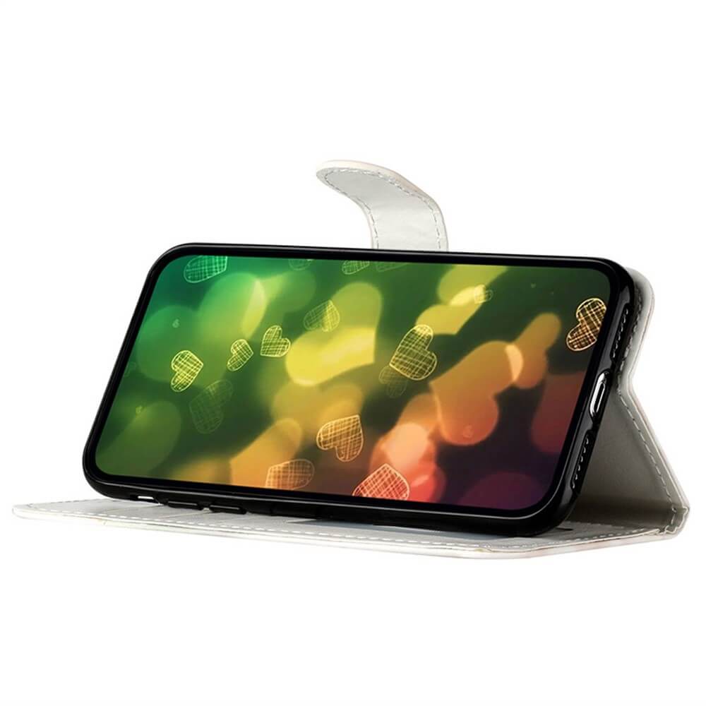 Die Cover-Discount iPhone 17 Pro - Tasche Hülle mit Motiv in Weiß steht aufrecht, zeigt ein Display mit leuchtendem Bokeh und Herzchen und bietet stilvollen Rundum-Schutz für Ihr Gerät.