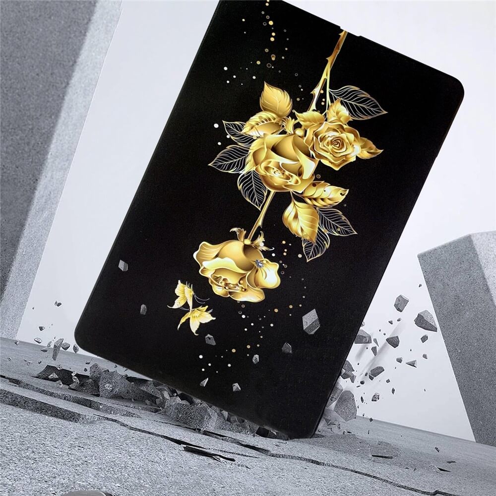 Eine schwarze Karte mit goldenen Rosen steht aufrecht inmitten von rissigem Beton und herumfliegenden Trümmern und erinnert an die Cover-Discount Kindle Paperwhite 2024 Schutzhülle TPU mit Motiv, die flexiblen Rundumschutz für dein Gerät bietet.