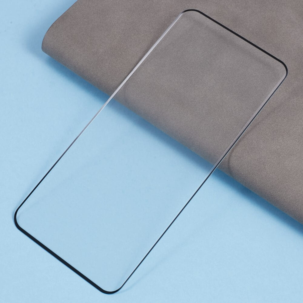 Eine transparente Cover-Discount Panzerglas Schutzfolie Display für Xiaomi Redmi Note 14 Pro 5G / Pro+ Plus / Poco X7 liegt auf einer blau-grauen Oberfläche.
