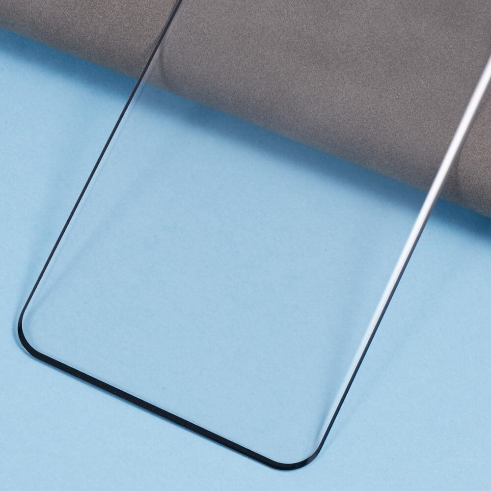 Auf einem blau-grauen Untergrund liegt ein Cover-Discount Panzerglas Schutzfolie Display von Cover-Discount für Xiaomi Redmi Note 14 Pro 5G / Pro+ Plus / Poco X7.