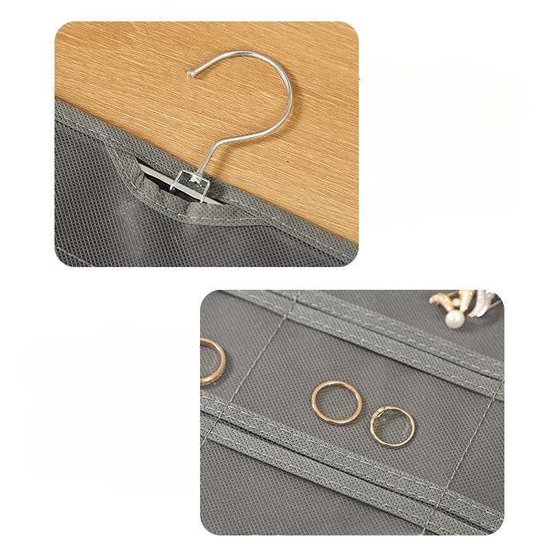 Der Cover-Discount Schmuckorganisator zum Aufhängen mit 48 Fächern bietet viel Platz für Ringe und Schmuck und verfügt über stabile Metallhaken – ideal zur Aufbewahrung auf einer Holzoberfläche.